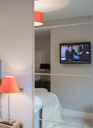 tv on wall in bedroom installation