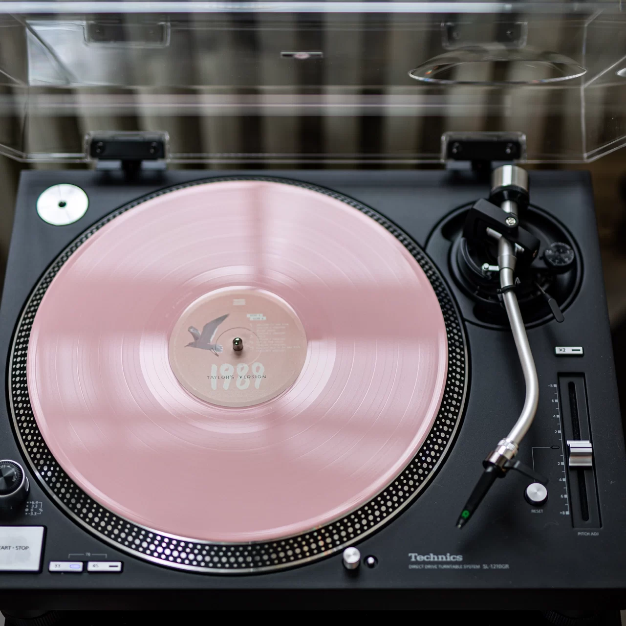 image shows a vinyl record on a turntable