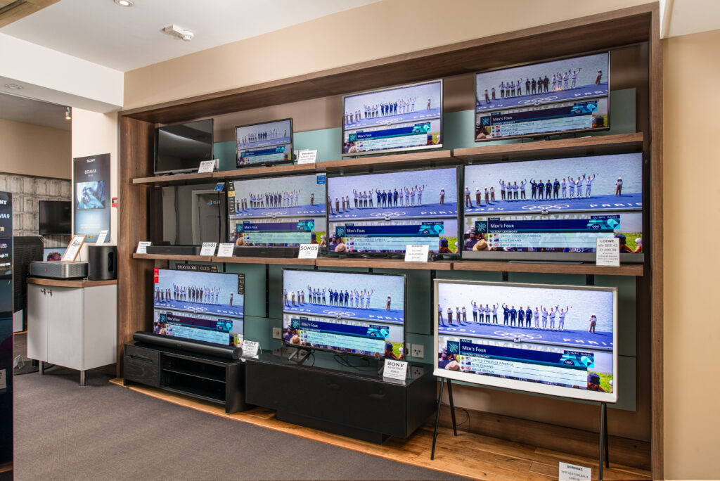 image shows TVs in a showroom