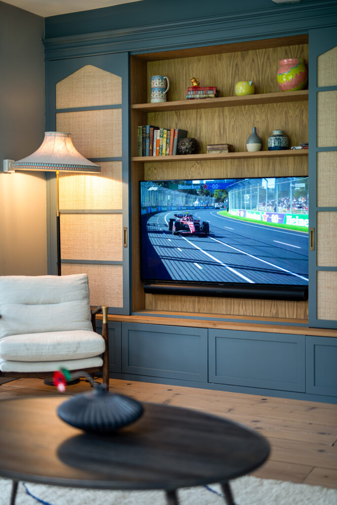 image shows TV recessed into a wall cabinet